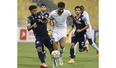Al Gharafa and Qatar SC players in action